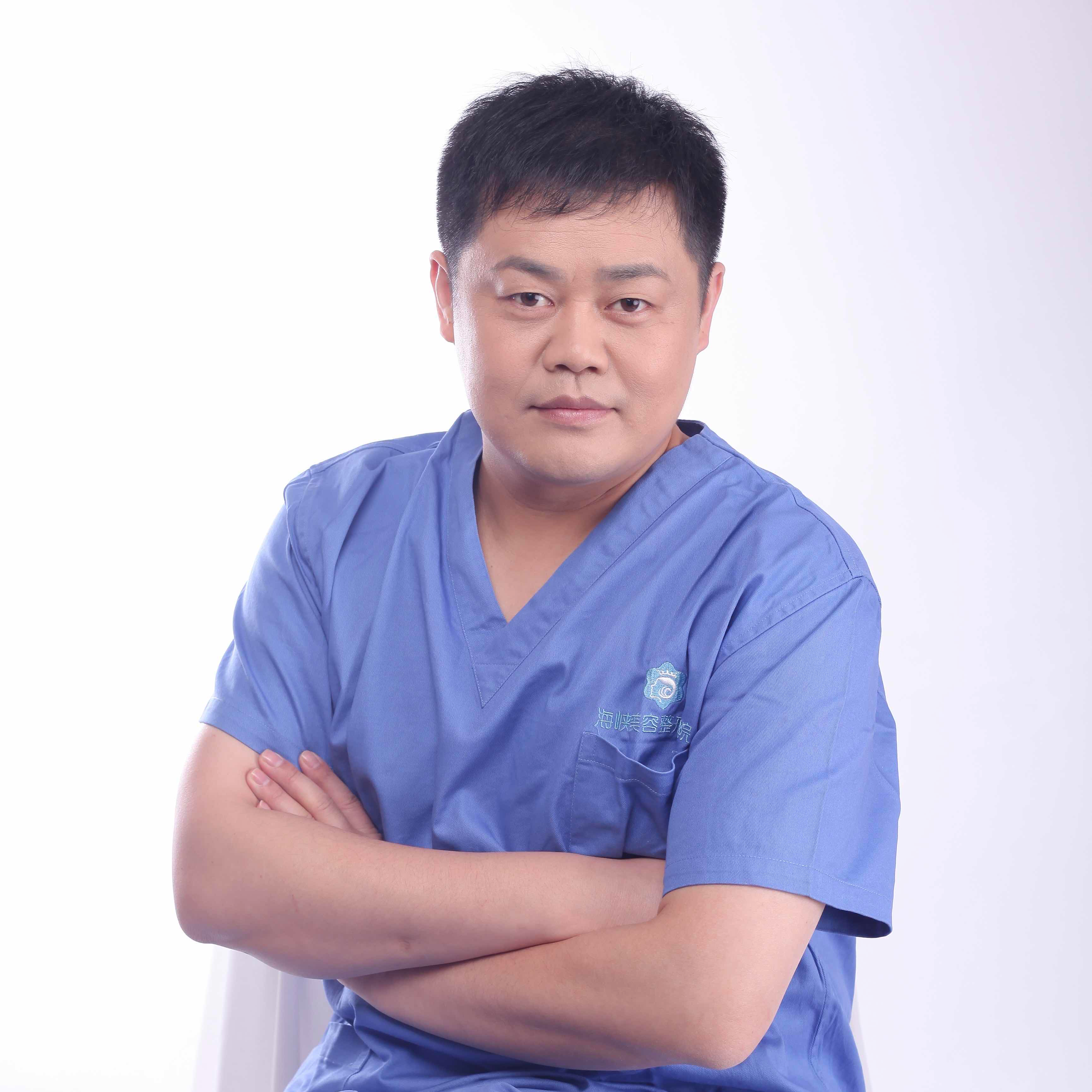 Dr. Miles Yang in surgical scrubs